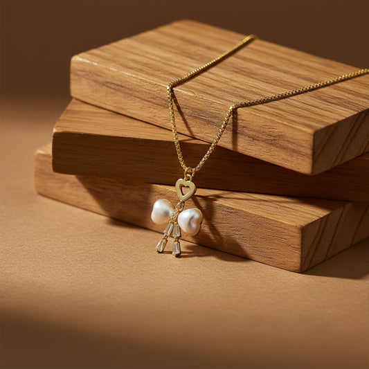 Elegant Gold Heart & Pearl Bow Necklace jewellery product view 2