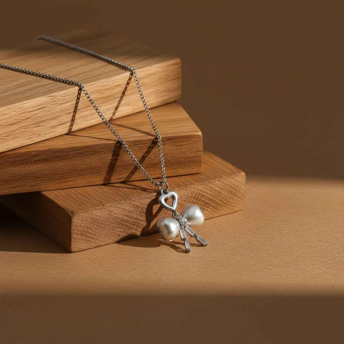 Elegant Silver Heart & Pearl Bow Necklace jewellery product view 1